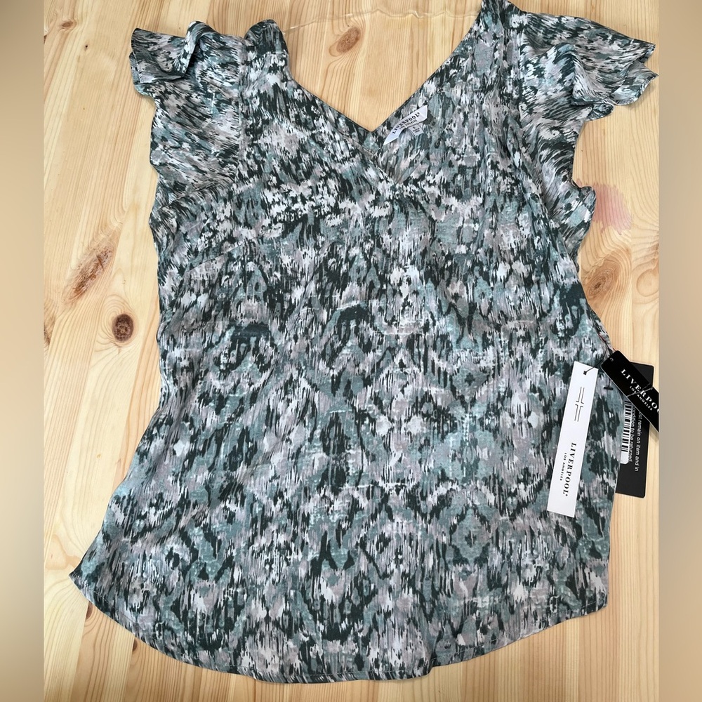 V-neck blouse with ruffled short sleeves